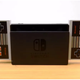 Photo of a Nintendo Switch with classic NES controllers attached